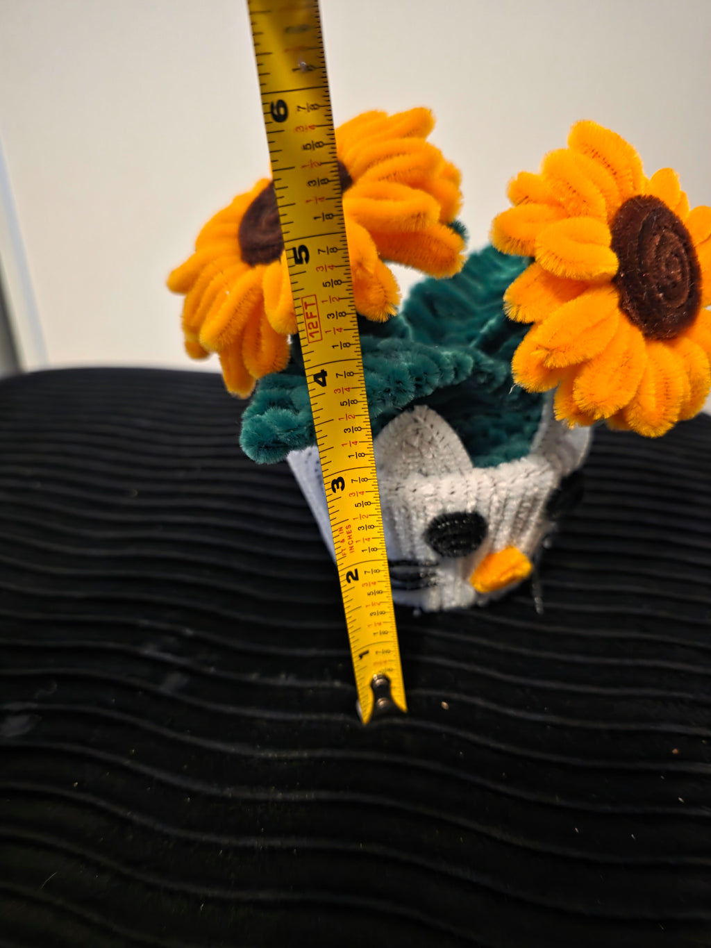 Handmade flower pot for decoration, made from pipe cleaners.